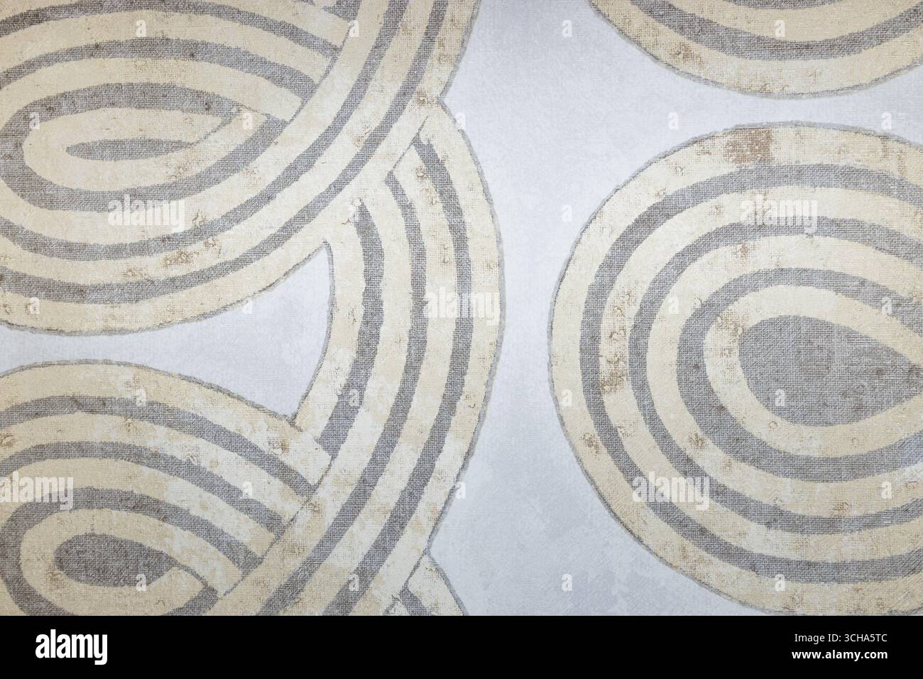 Motif circulaire en spirale minimaliste en beige sur fond clair, texture géométrique abstraite Banque D'Images