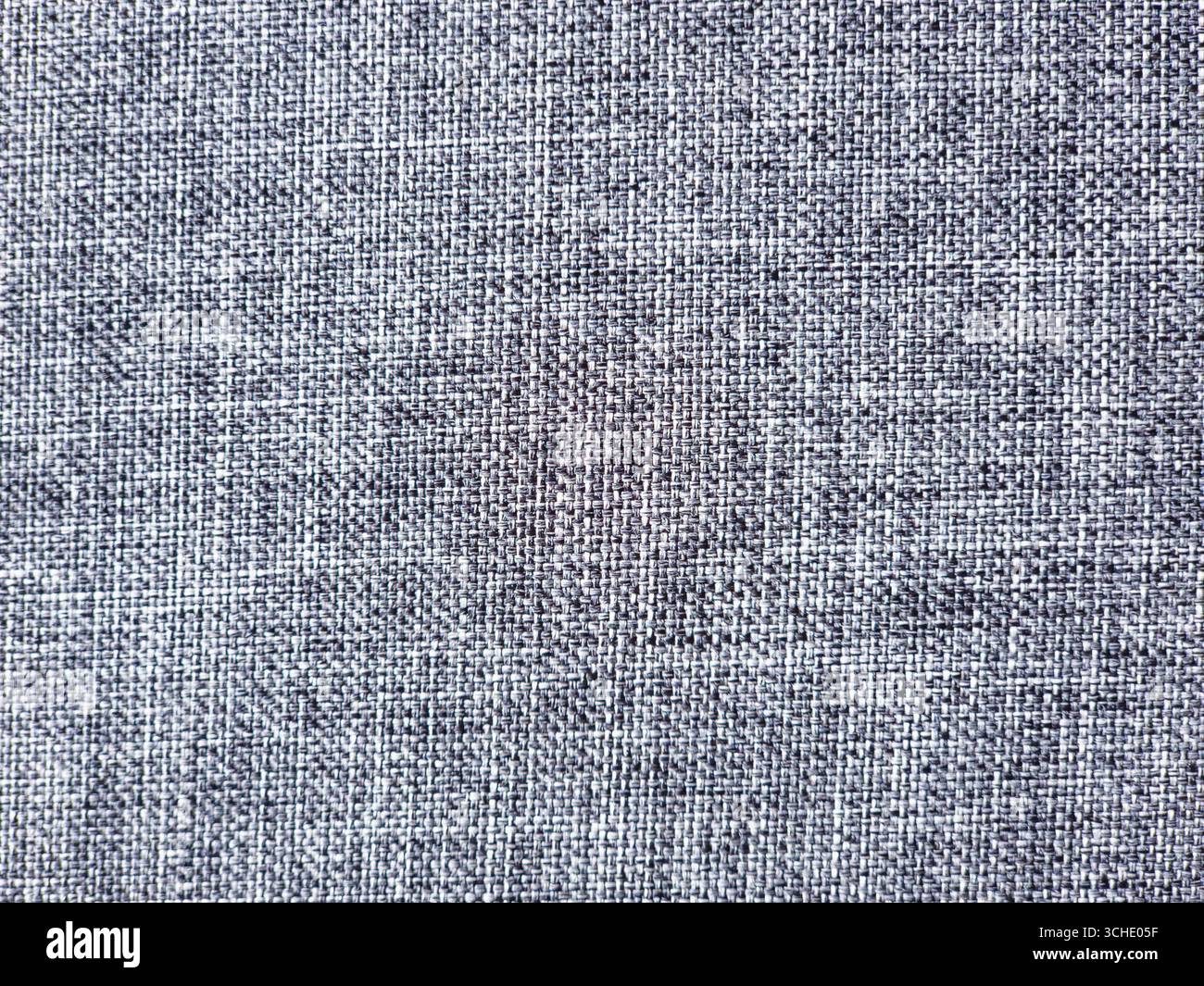 La texture grise du tissu fournit un fond texturé sans couture, idéal pour les projets de conception nécessitant un look subtil et sophistiqué, ajoutant de la profondeur et du graphisme Banque D'Images