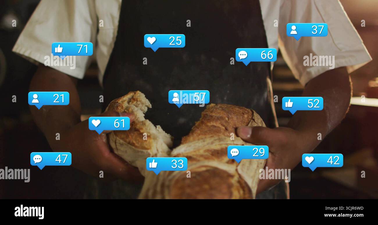 Arrachant le pain rustique boulanger adulte portant tablier à la cuisine de boulangerie, avec des icônes de réaction flottantes Banque D'Images