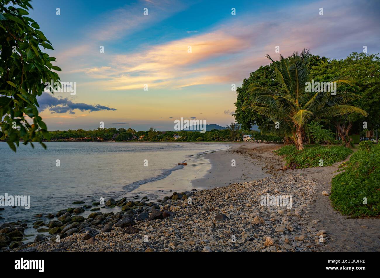 Coucher de soleil à Tamarin public Beach, Maurice Banque D'Images