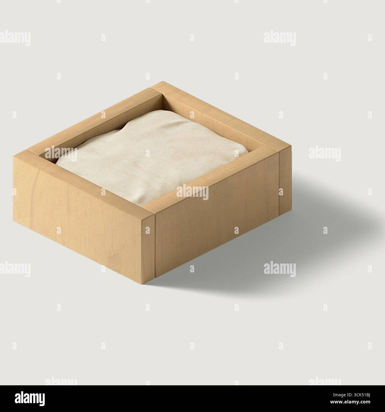 Boîte en bois contenant une substance blanche et molle, représentant probablement un aliment ou un ingrédient culinaire. Banque D'Images