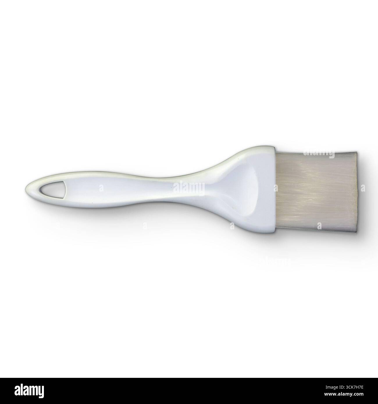 Pinceau blanc à tête plate et large, généralement utilisé pour peindre ou appliquer des sauces. Banque D'Images