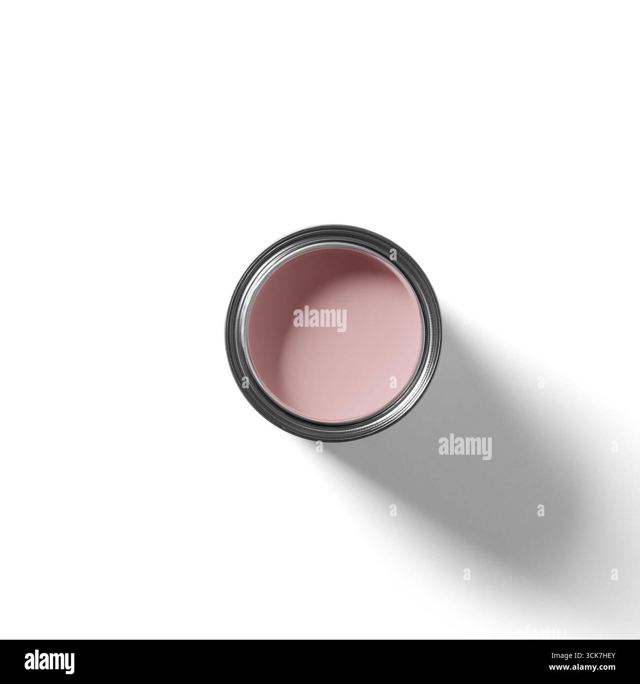 Une vue de haut en bas d'un récipient rond rempli d'une substance rose tendre, probablement un produit cosmétique. Banque D'Images