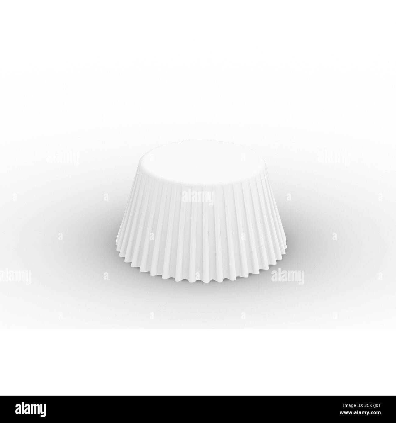 Un gobelet blanc cannelé utilisé pour les cupcakes ou les muffins, présentant un design simple pour la préparation des aliments. Banque D'Images