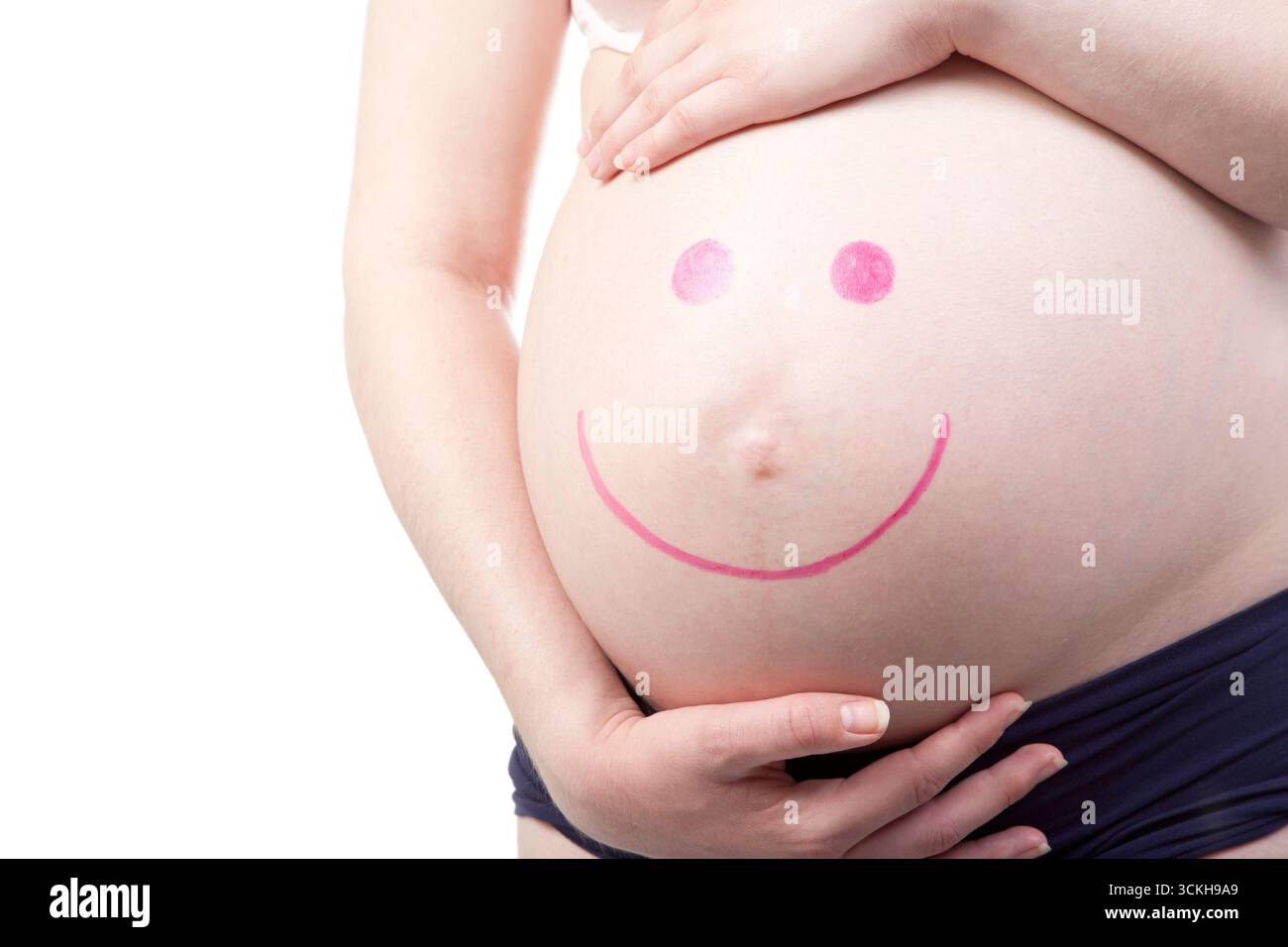 ventre enceinte, visage souriant, grossesse, anticipation, maternité, bosse de bébé, attente, grossesse heureuse, maternelle, nouvelle vie, joie, joyeux, future maman, ventre, rose Banque D'Images
