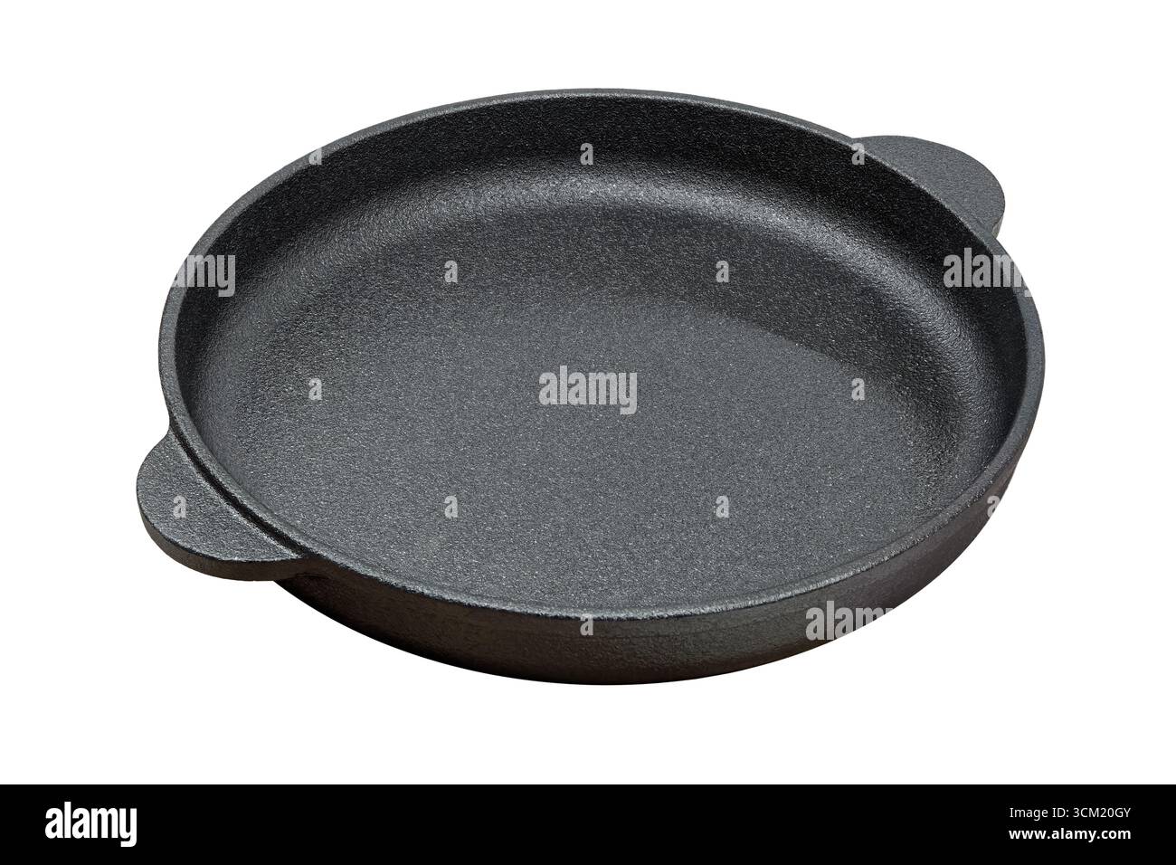 Poêle ronde en fonte, isolée sur fond blanc Banque D'Images