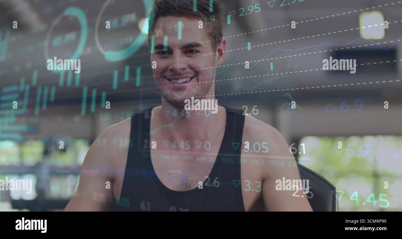 Console de saisie, homme en haut noir sans manches entraînement au gymnase, avec superpositions de graphiques financiers Banque D'Images