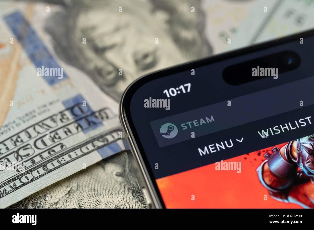 New York, États-Unis - 12 septembre 2025 : plate-forme de jeu à vapeur sur écran de smartphone avec fond dollar vue rapprochée Banque D'Images