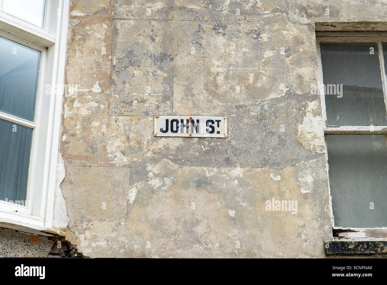 Vieux panneau de nom de rue John Street en métal Banque D'Images