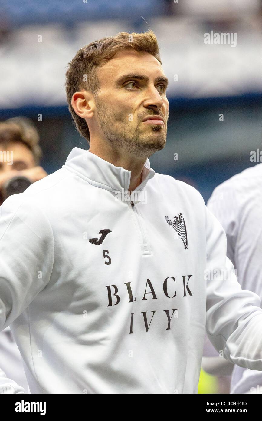 Warren O'Hora, footballeur professionnel, joue actuellement pour l'Hibernian FC. Image prise lors d'un échauffement avant match et d'une séance d'entraînement. Banque D'Images