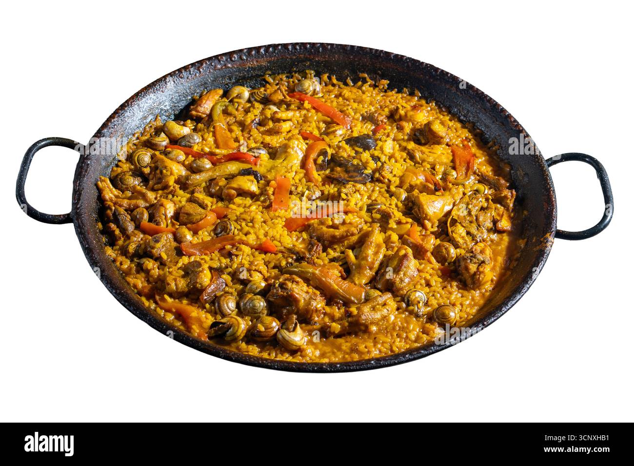 Un bol de nourriture avec beaucoup d'ingrédients différents, y compris de la viande et des légumes. Le bol est dans une poêle noire et argentée Banque D'Images