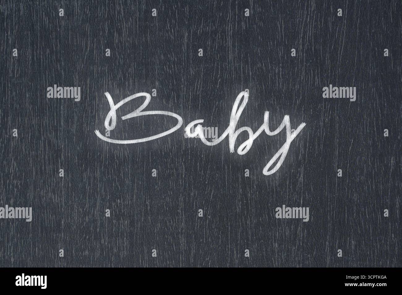 Un tableau noir avec un message manuscrit à la craie qui dit bébé, un symbole puissant de la réussite commerciale et de la motivation dans l'éducation et la production Banque D'Images