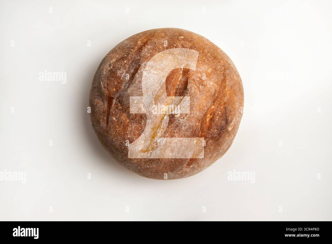 Symbole de livre sterling sur le pain. Symbolise l'économie britannique, les prix des denrées alimentaires et la crise du coût de la vie. Banque D'Images