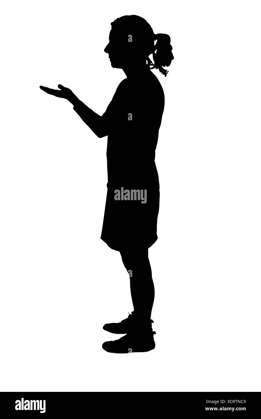 silhouette de vue de côté d'une femme montrant un objet imaginaire dans sa main Banque D'Images