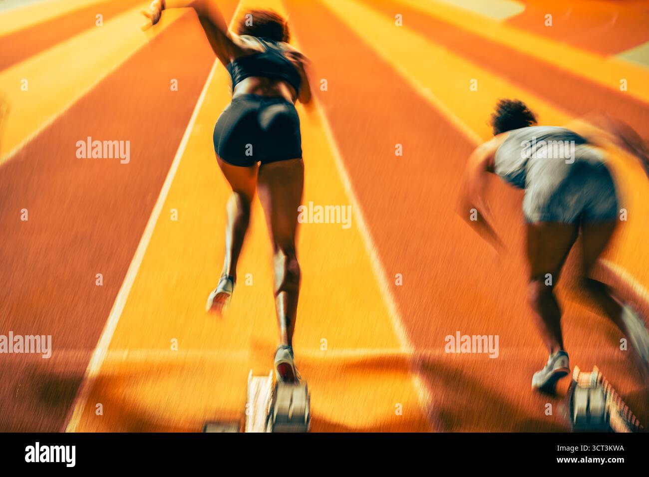 Un début de course de vitesse athlétique sur piste Banque D'Images