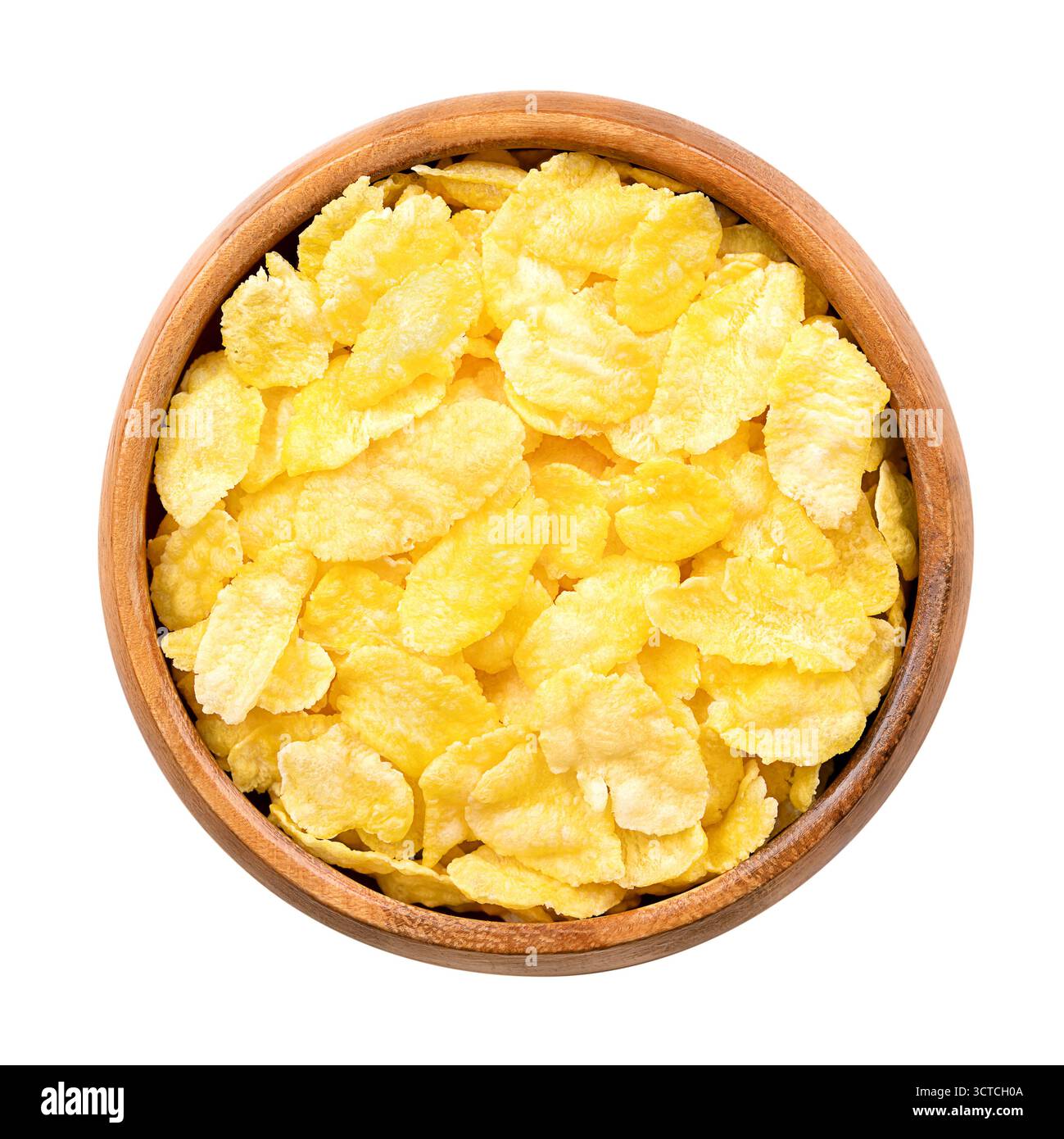 Flocons de maïs, ou cornflakes dans un bol en bois. Céréales pour le petit-déjeuner à base de grillades de maïs ou de maïs. Aliment populaire dans le régime américain. Banque D'Images Flocons de maïs, ou cornflakes dans un bol en bois. Céréales pour le petit-déjeuner à base de grillades de maïs ou de maïs. Aliment populaire dans le régime américain. Banque D'Images