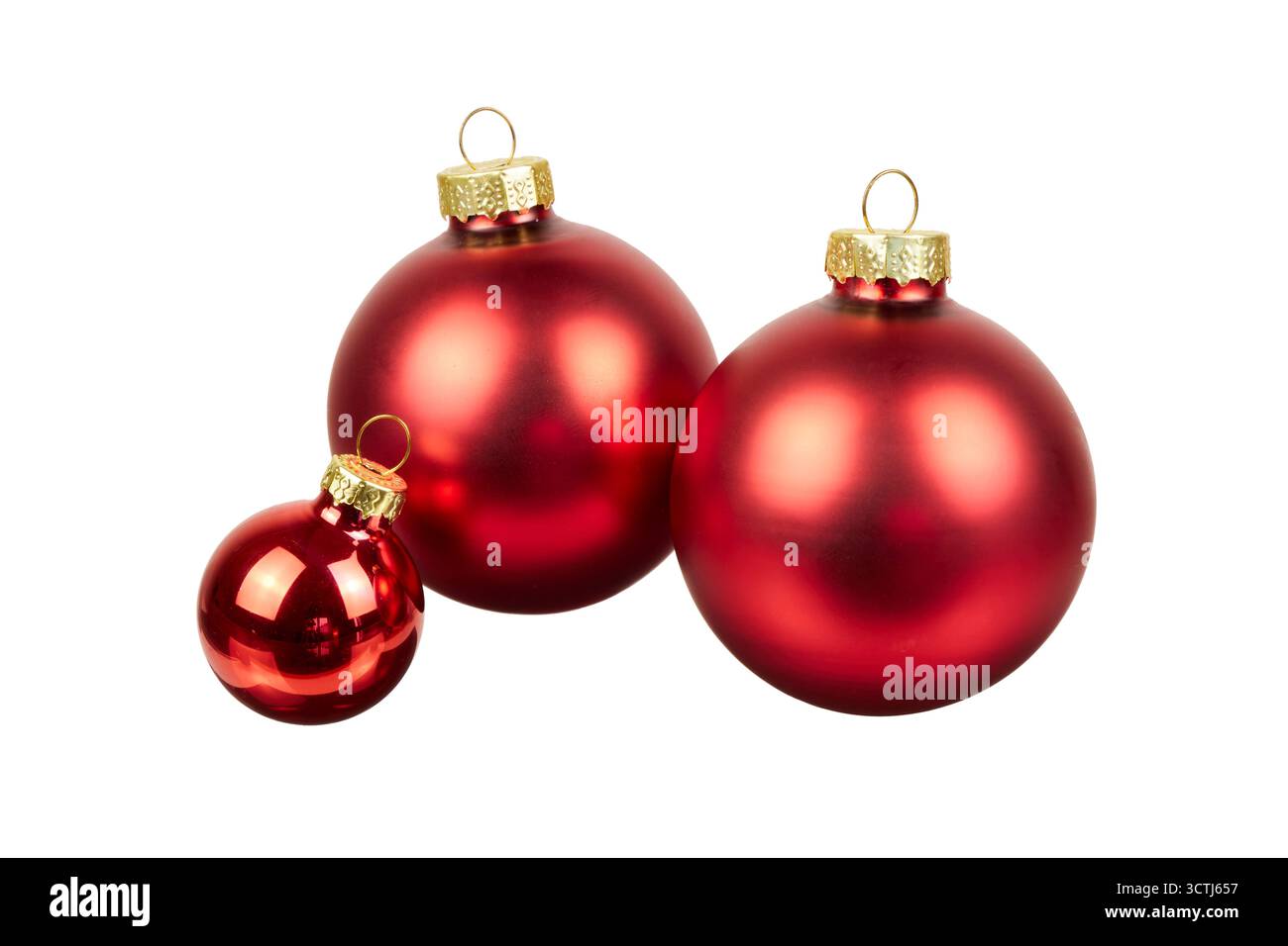 décoration de trois boules de noël rouges isolée sur blanc Banque D'Images