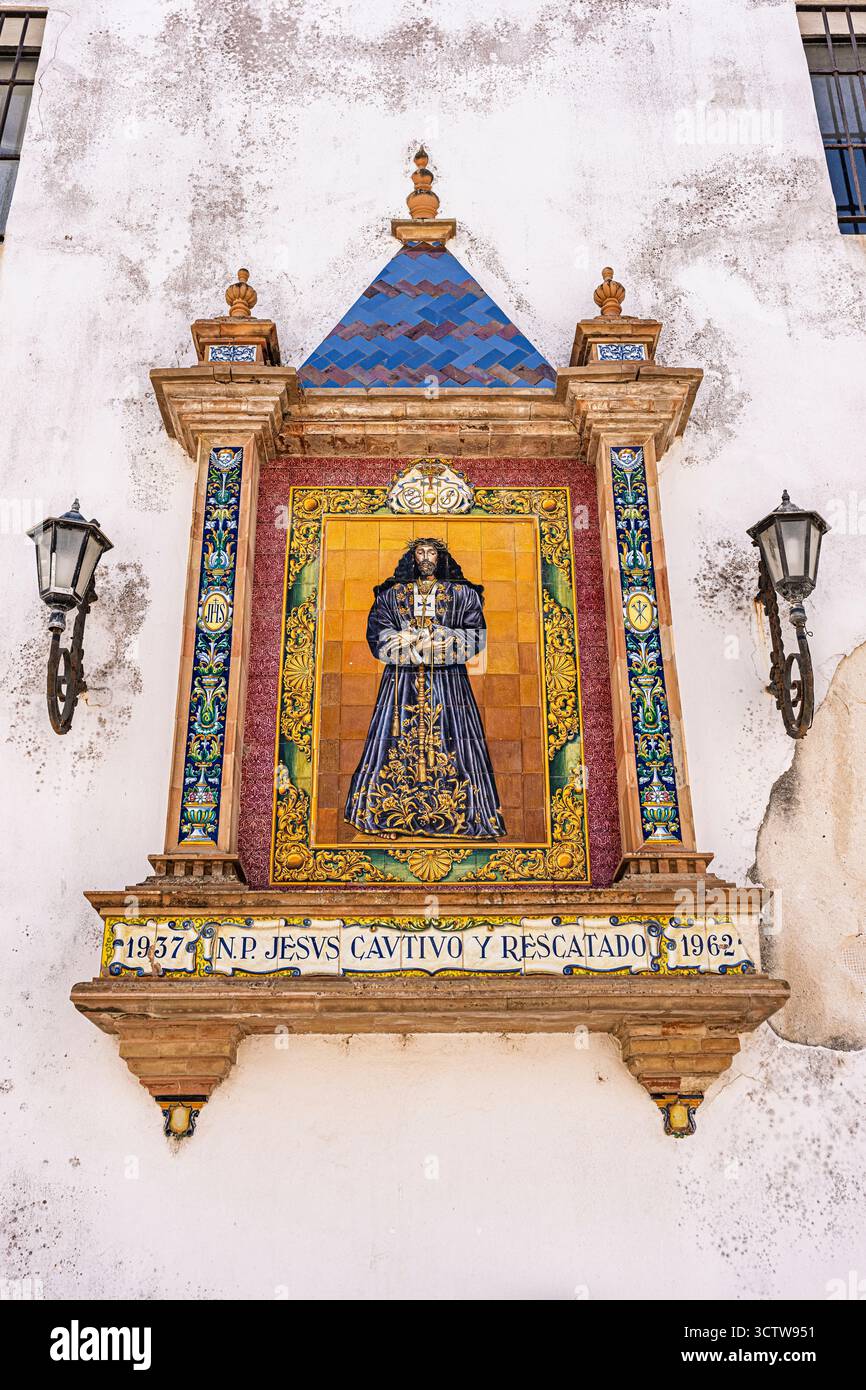 Un art mural religieux sur le mur d'une église à Cadix, Espagne en Europe. Banque D'Images