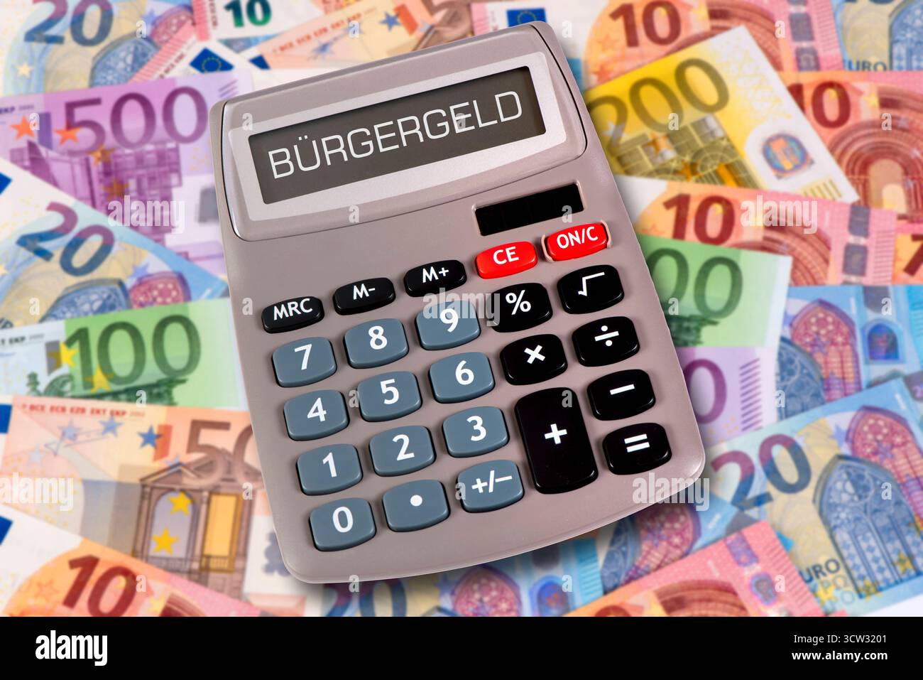 Bürgergeld als Grundeinkommen Das Display von einem Taschenrechner ist beschriftet mit Bürgergeld als Symbol für Grundeinkommen *** citoyens revenu AS Banque D'Images