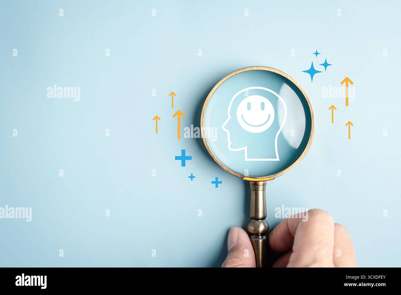 Concept de bien-être et de positivité avec loupe se concentrant sur le sourire de tête humain, la santé mentale Banque D'Images