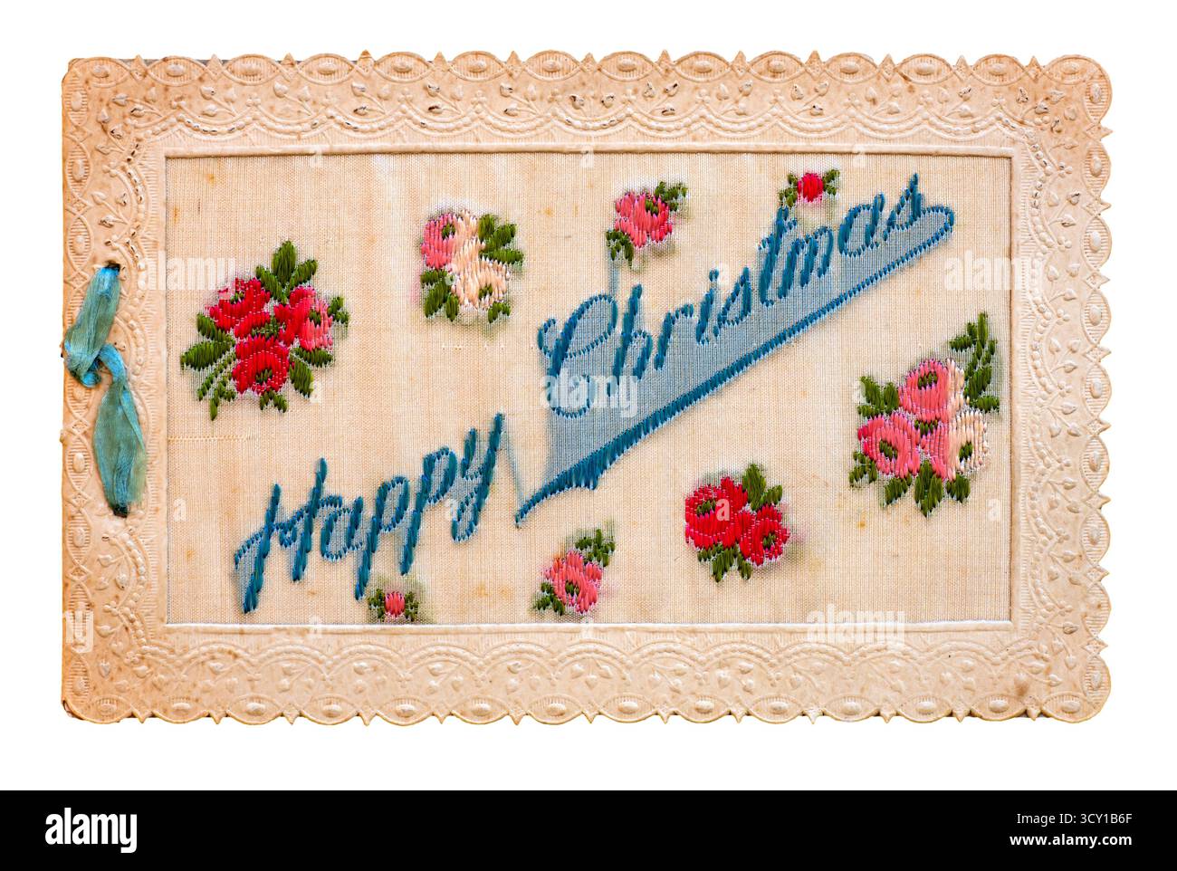 WW ! Carte de voeux de Noël brodée en soie 'joyeux Noël' parmi plusieurs fleurs rouges. Banque D'Images