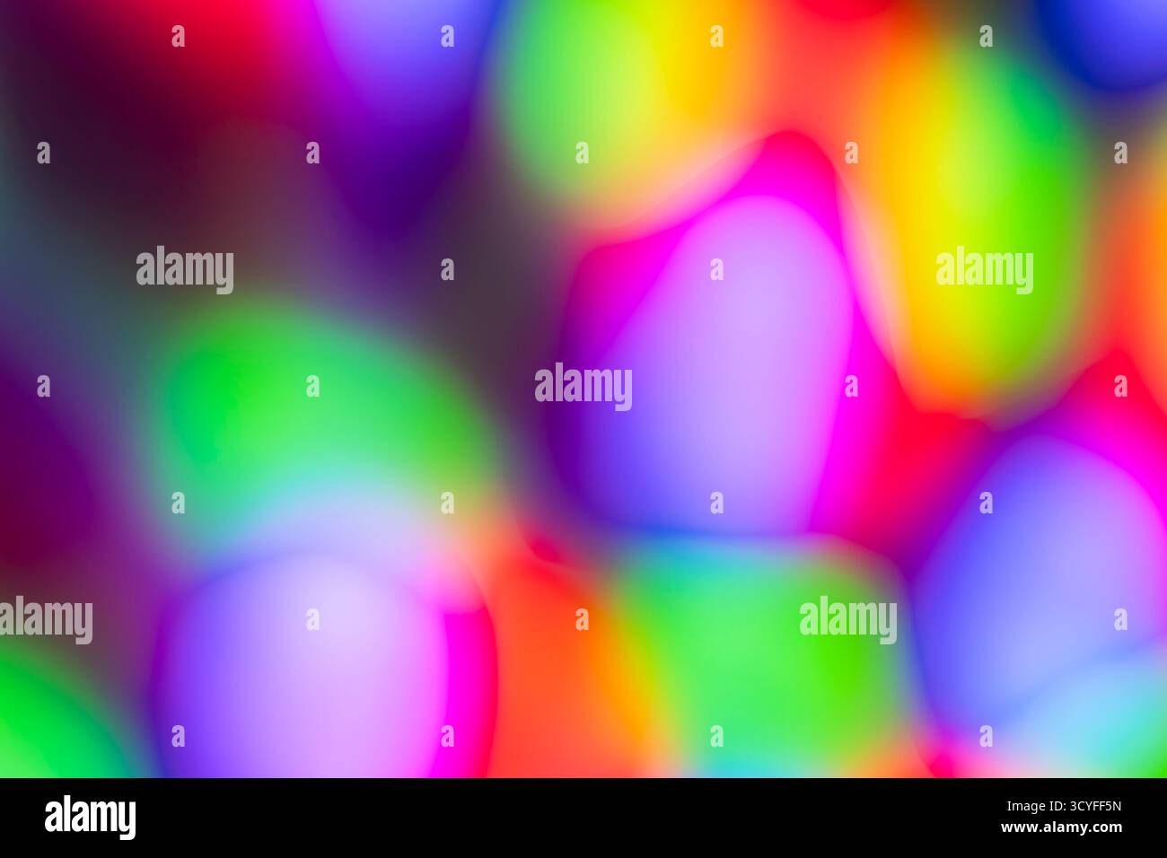 Bokeh bleu, vert et rouge – fond abstrait des fêtes avec guirlande de Noël floue Banque D'Images
