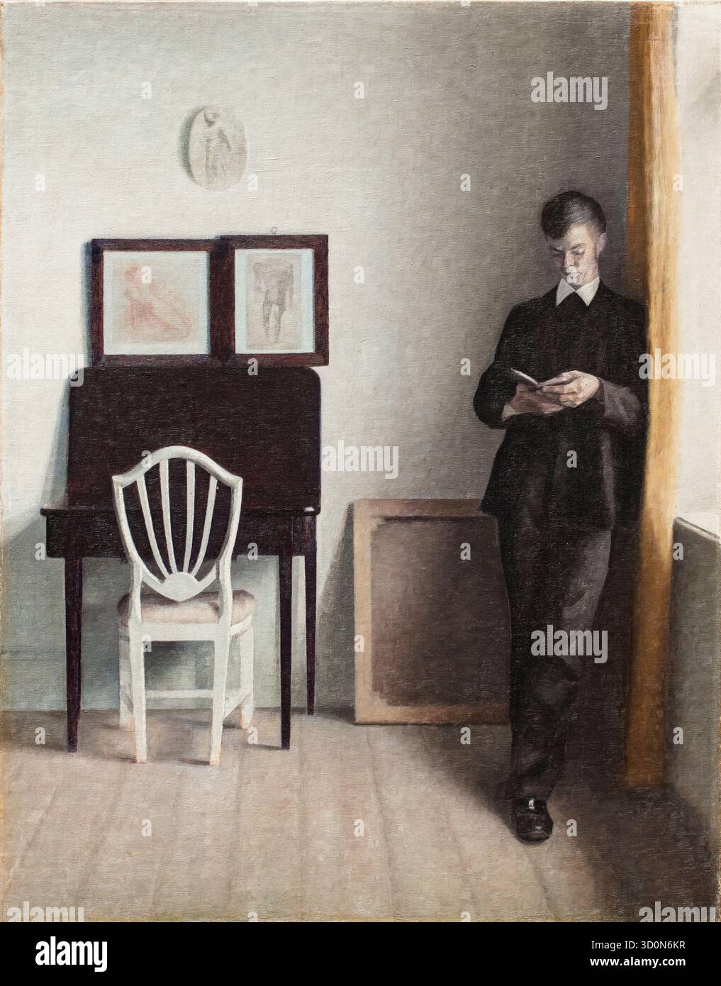 Vilhelm Hammershoi, intérieur avec jeune homme lisant, peinture à l'huile sur toile, 1898 Banque D'Images
