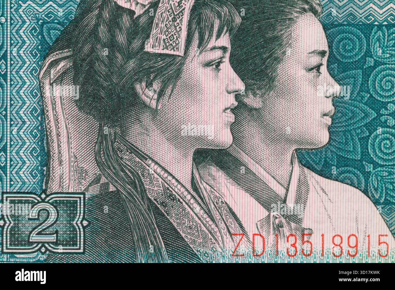 Gros plan d'un billet de banque mettant en vedette deux jeunes femmes dans un motif complexe sarcelle avec un numéro « 2 » et un numéro de série bien en vue. Banque D'Images