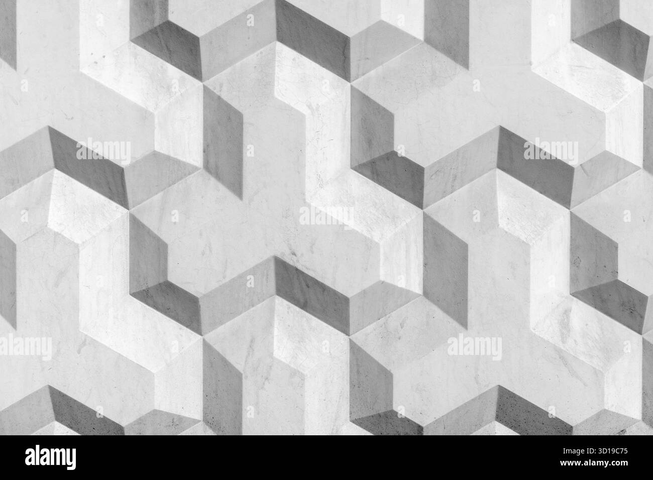 Motif de mur en béton géométrique avec un design cubique tridimensionnel dans des tons de gris créant un effet visuel artistique et élégant pour le design proje Banque D'Images