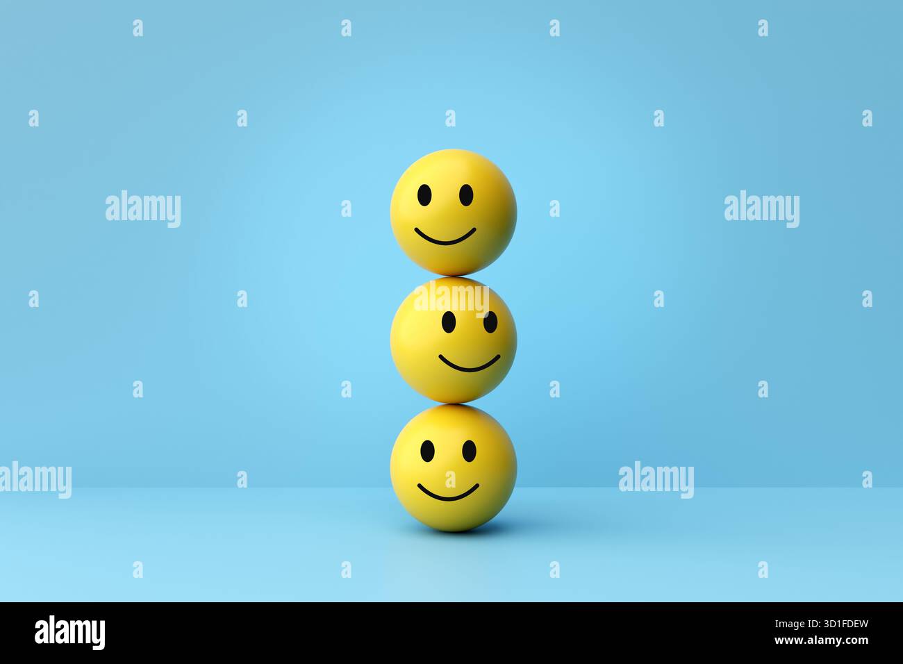 Émoticône jaune des balles de visage empilées dans une colonne, représentant le bonheur, les émotions positives, la satisfaction du client et le bien-être mental Banque D'Images