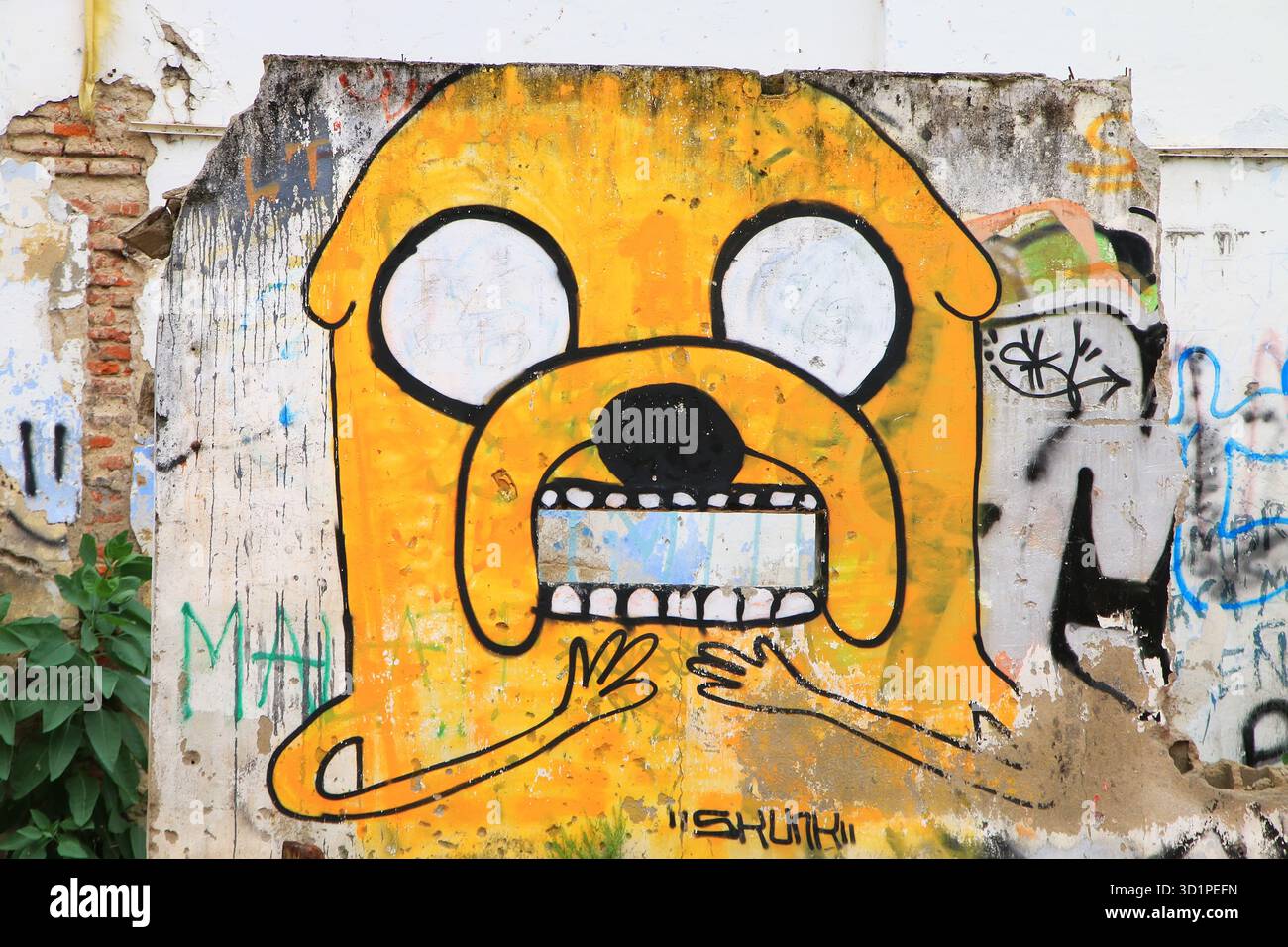 Graffiti sur un mur dans le quartier historique de Colonia del Sacramento, Uruguay. Banque D'Images