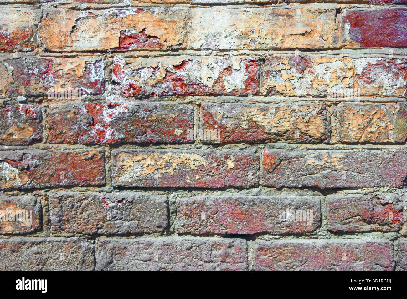 Vieux mur de briques peint en rouge Banque D'Images