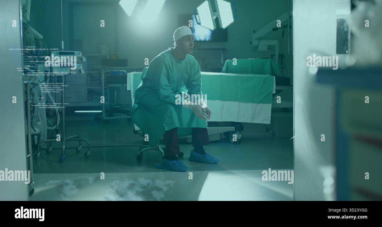 Chirurgien penchant serrant les mains sur les selles dans les frottements au BLOC OPÉRATOIRE, avec des lampes chirurgicales et des moniteurs Banque D'Images
