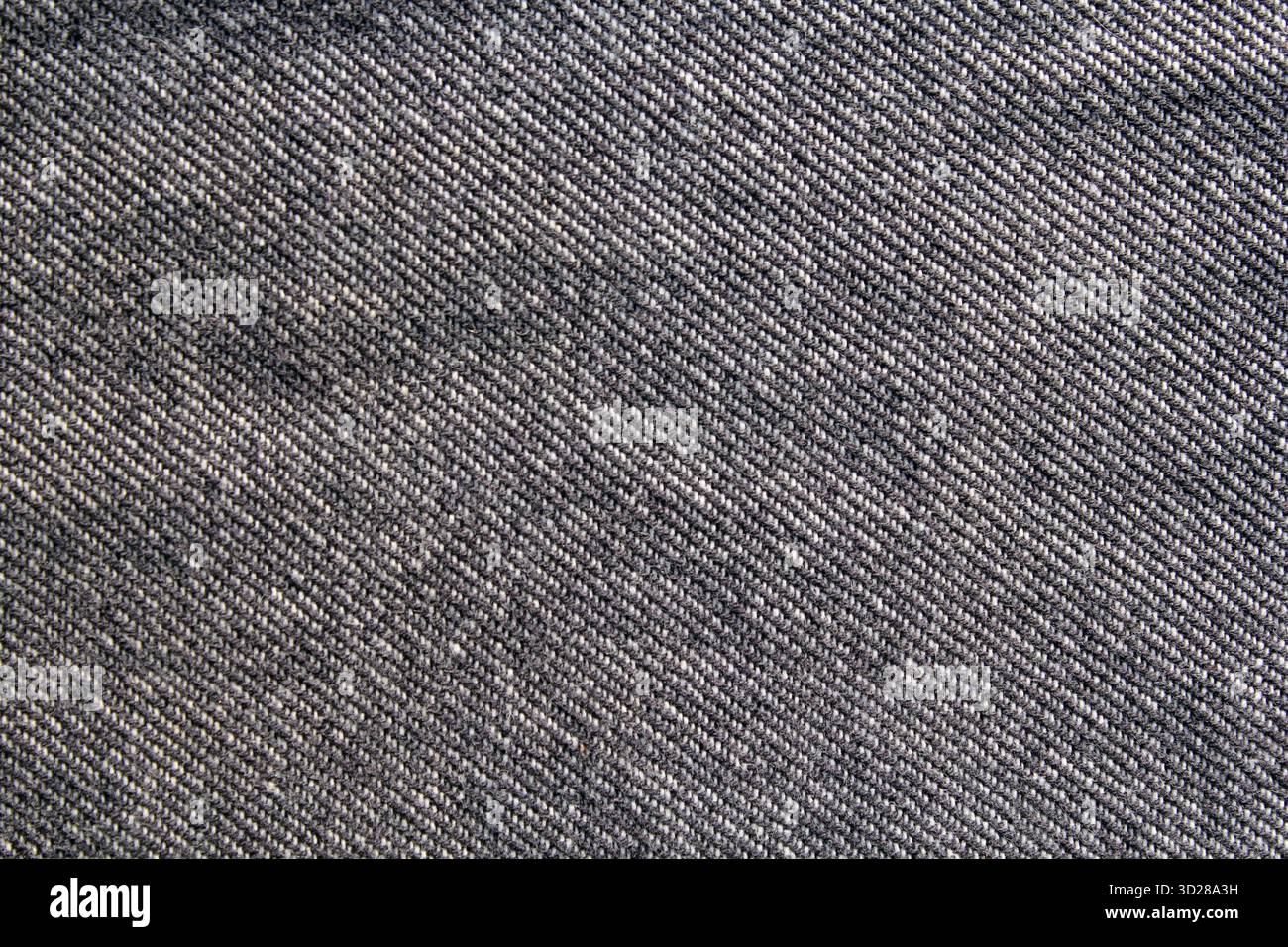 Gros plan d'un motif de tissage sur fond texturé abstrait de tissu denim gris gris gris Banque D'Images