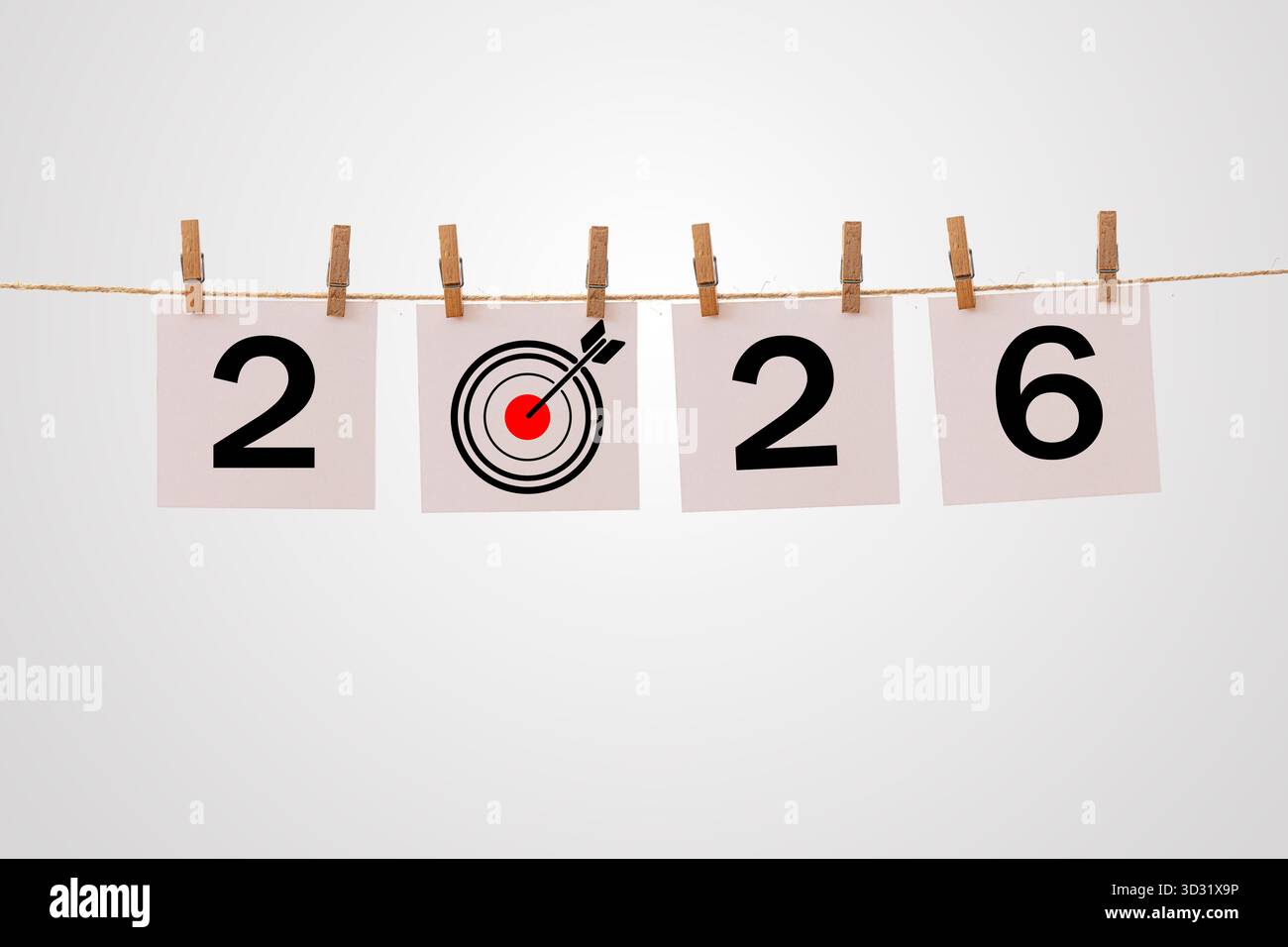 Concept créatif de l'année 2026 montrant la cible d'affaires et l'idée de succès avec des numéros suspendus sur la corde et la fléchette frappant le symbole Bullseye, représentant goa Banque D'Images