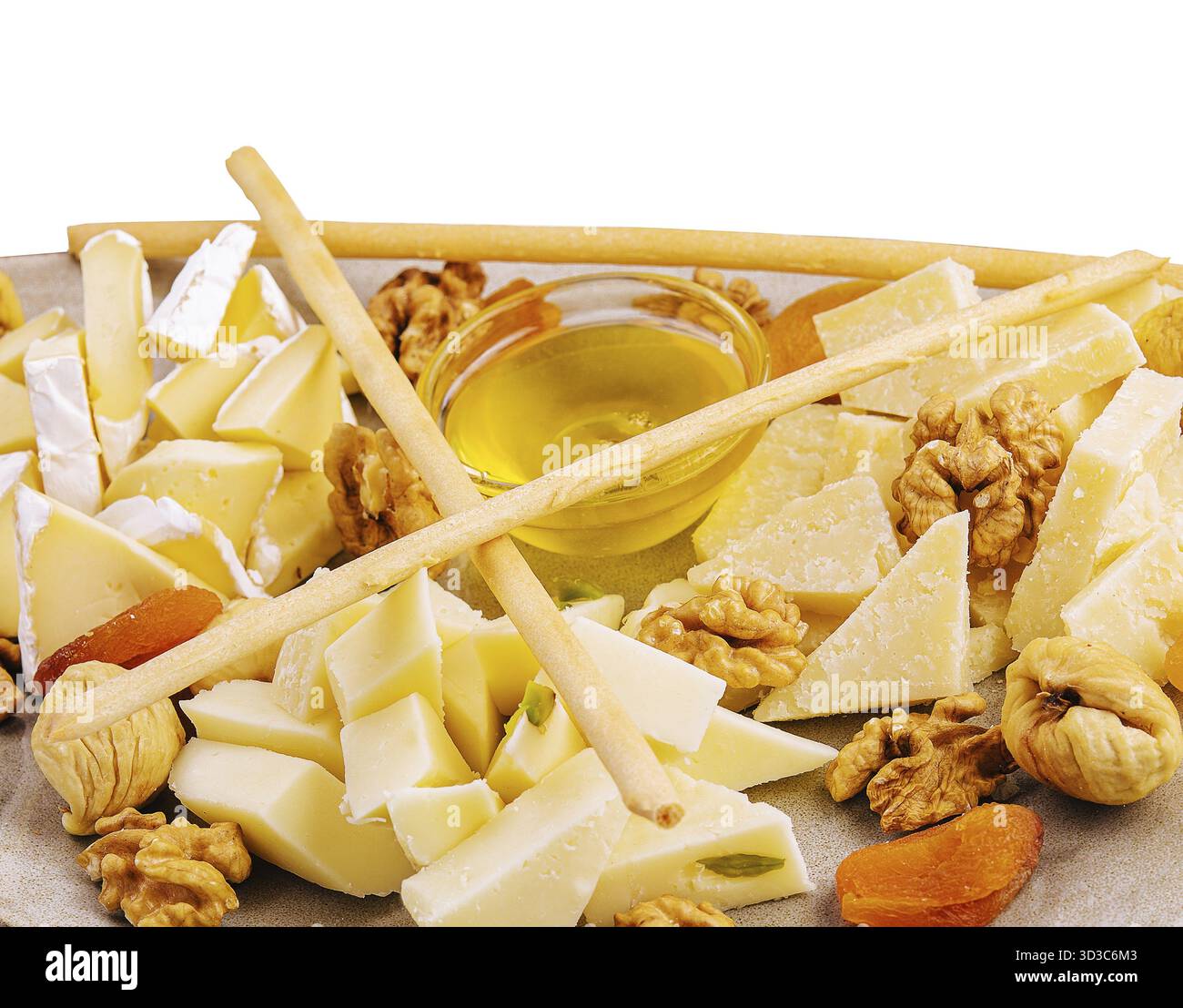 Nourriture, assiette de fromage avec noix et miel Banque D'Images