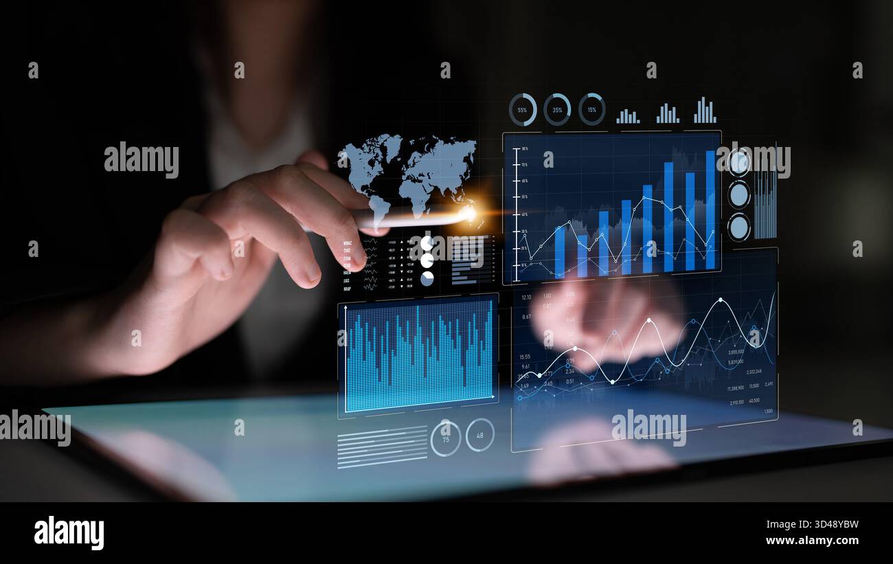 Un professionnel des affaires interagit avec une interface numérique, analysant des graphiques et des graphiques complexes, mettant en valeur des informations financières et les tendances actuelles Banque D'Images