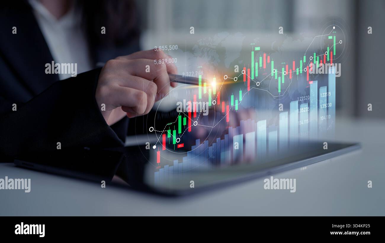 Professionnel des affaires effectue une analyse boursière à l'aide d'une tablette pour afficher des graphiques financiers, mettant en évidence les tendances actuelles et les opportunités d'investissement Banque D'Images