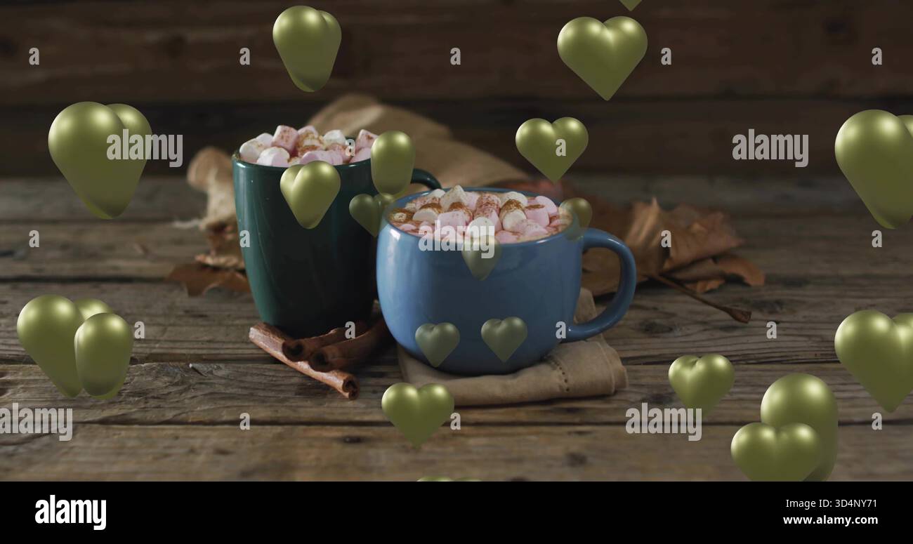Assis mugs en céramique bleu et vert vapeur dans une cuisine confortable, avec guimauves, cannelle, coeurs Banque D'Images