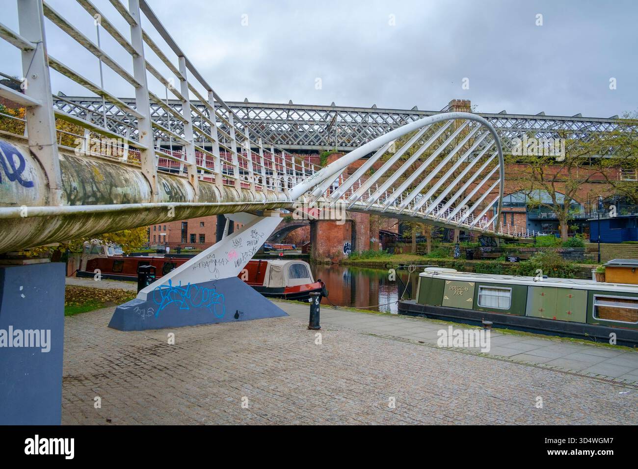 Pont de marchands traversant le canal Bridgewater à Castlefield dans le centre-ville de Manchester. Banque D'Images