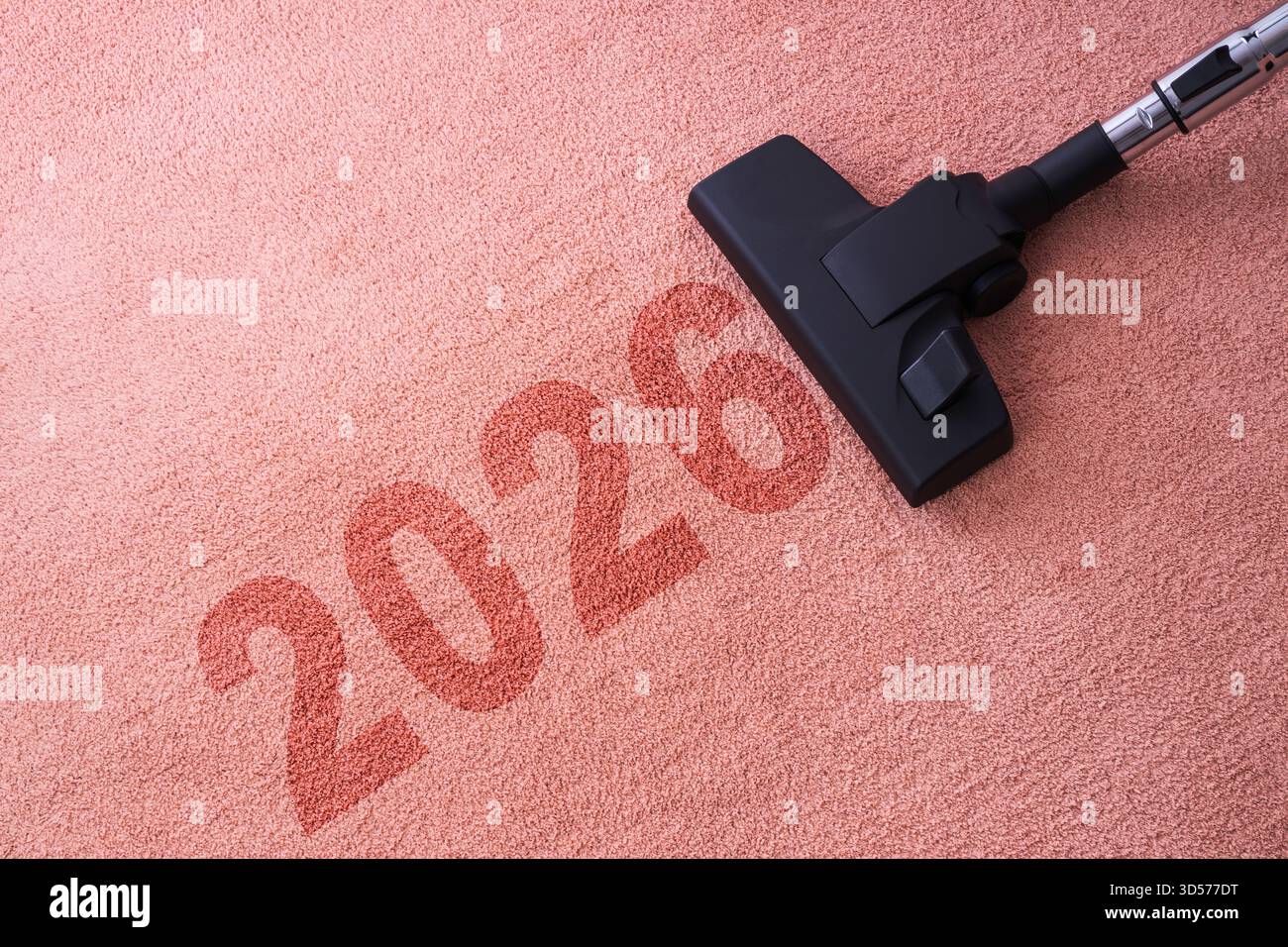 2026 nouvel an nettoyage de la maison et de la moquette avec aspirateur et espace de copie pour un texte Banque D'Images