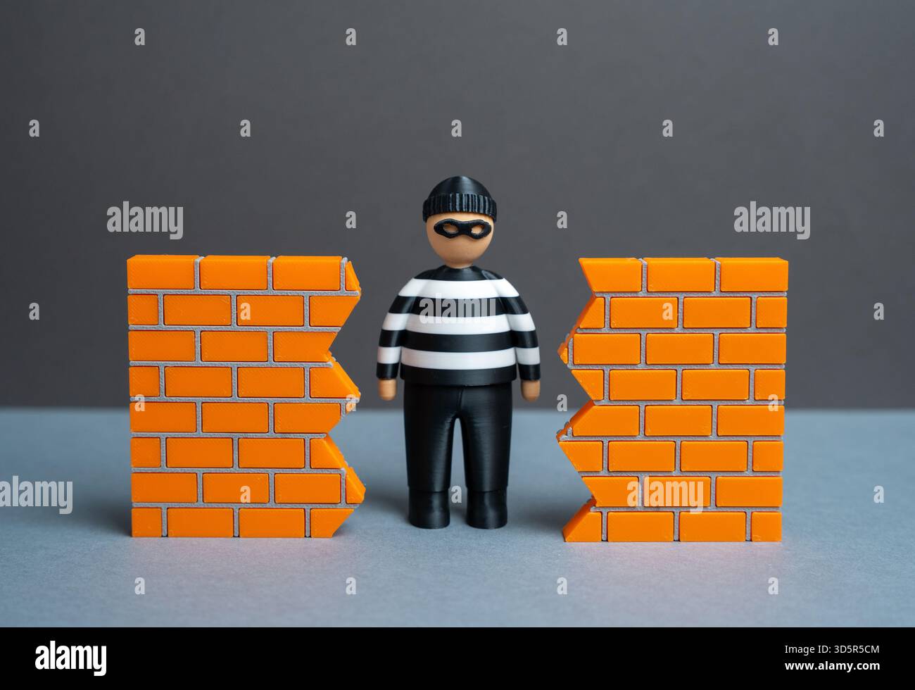 Un criminel trouve un trou dans le mur. Une faille de sécurité. La menace du vol de données et de la cybersécurité. Vulnérabilité du système et accès non autorisé. H Banque D'Images