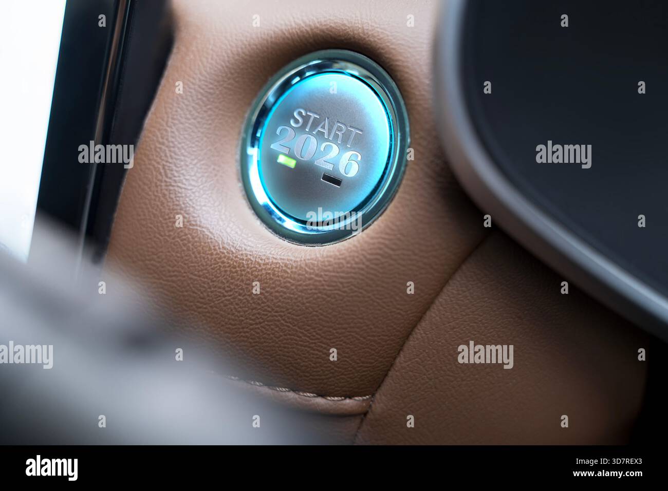 Bouton de démarrage éclairé étiqueté « Start 2026 » dans le tableau de bord de voiture moderne, symbolisant les nouveaux départs, la technologie automobile futuriste et l'innovation fo Banque D'Images