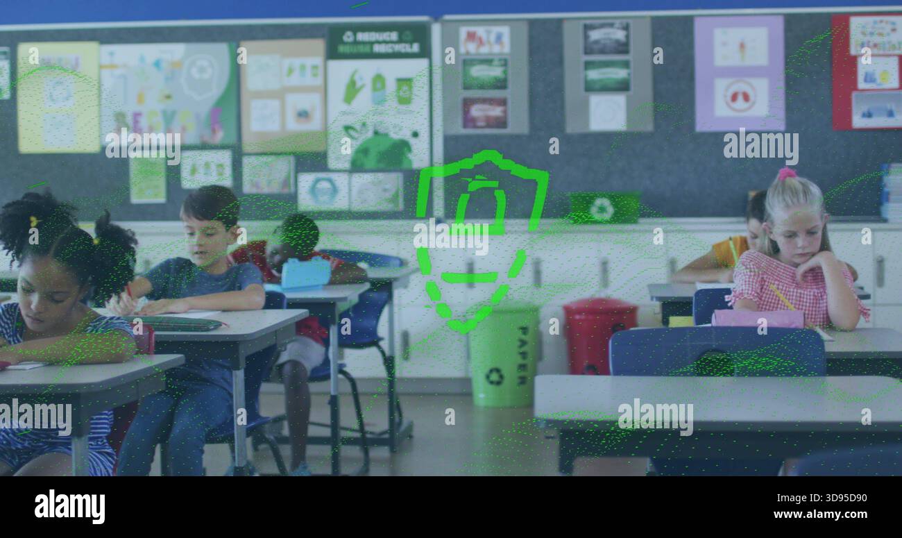 Écriture élèves portant des manches courtes et des robes à motifs en classe, avec bac de recyclage Banque D'Images