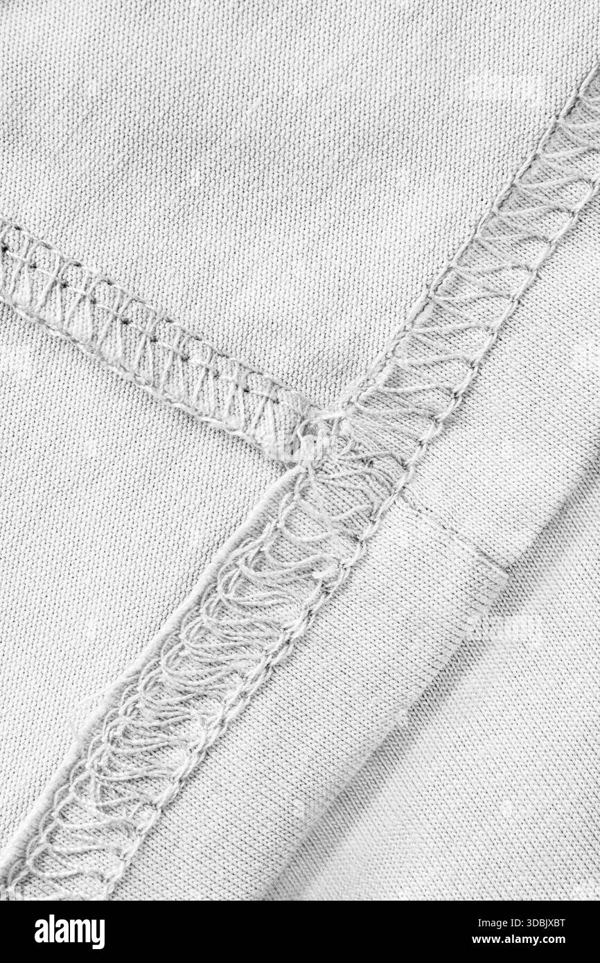 Détails de tissu de coton cousu blanc gros plan comme arrière-plan Banque D'Images