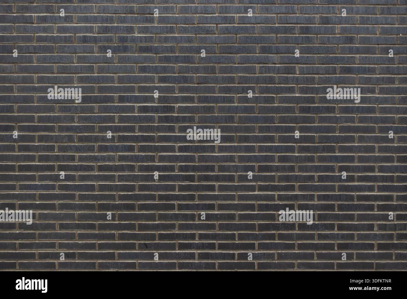 Mur de briques grises avec motif de maçonnerie horizontal uniforme, texture architecturale propre appropriée comme fond urbain moderne Banque D'Images