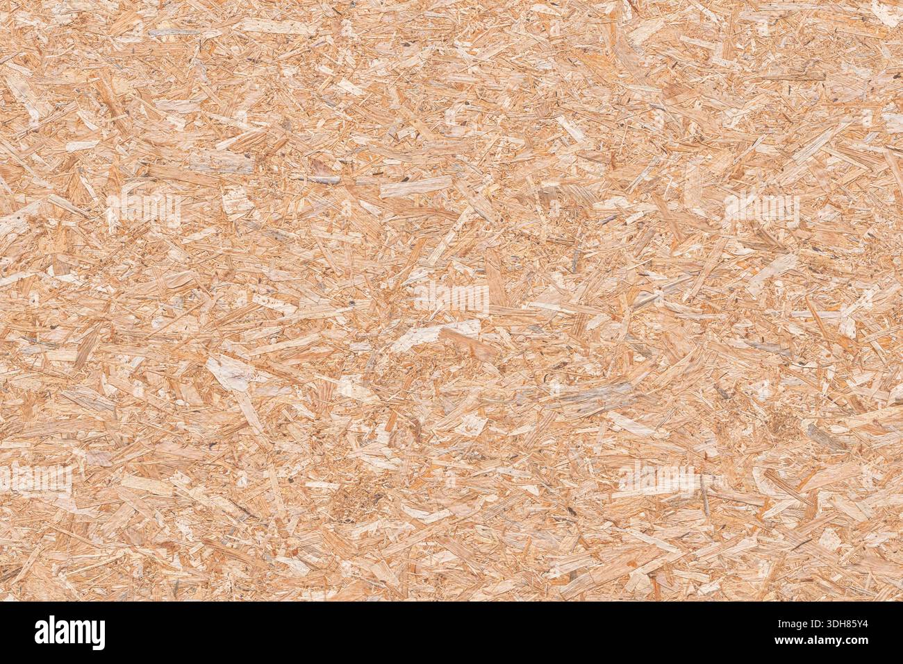 Macro haute résolution d'un panneau OSB en flocons de bois pressés. Fond naturel de texture en bois pour la construction, le design d'intérieur et industriel Banque D'Images