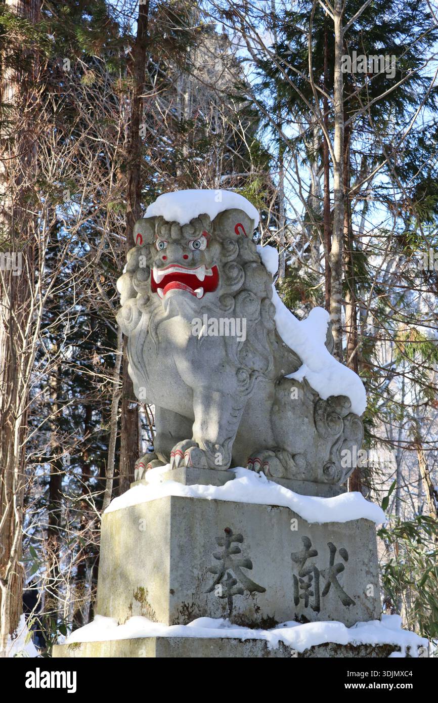 Sculpture de lion dans la neige Banque D'Images