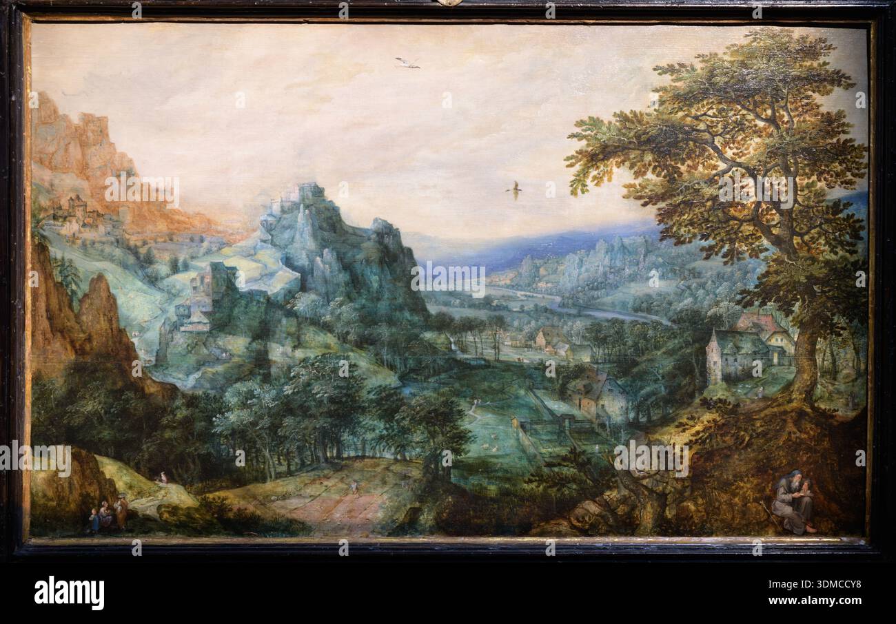 Paysage de l'école flamande du XVIe-XVIIe siècle avec un ermite, situé dans la Biblioteca Ambrosiana, Milan. Banque D'Images