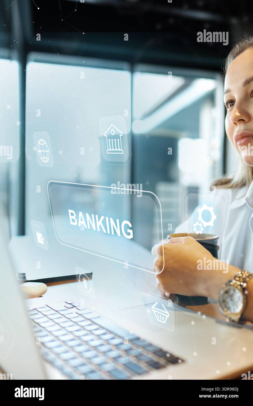 L'utilisateur examine le paiement des factures bancaires tout en utilisant un ordinateur portable dans un espace de travail moderne Banque D'Images